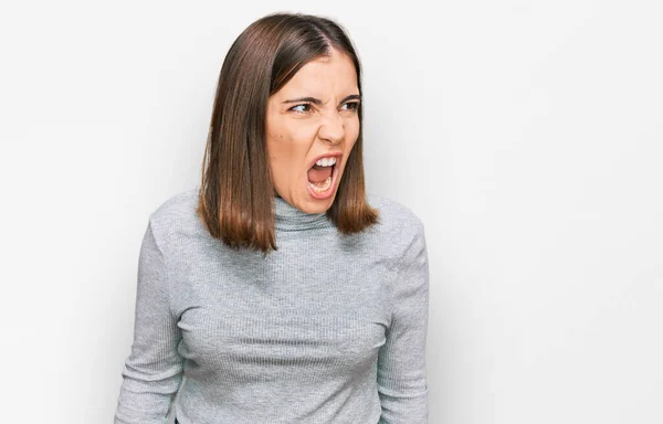 Young Beautiful Woman Wearing Casual Turtleneck Sweater Angry Mad Screaming — Stock Photo, Image