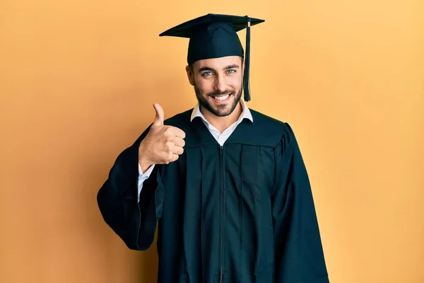 Young Hispanic Man Wearing Graduation Cap Ceremony Robe Doing Happy — Stock fotografie