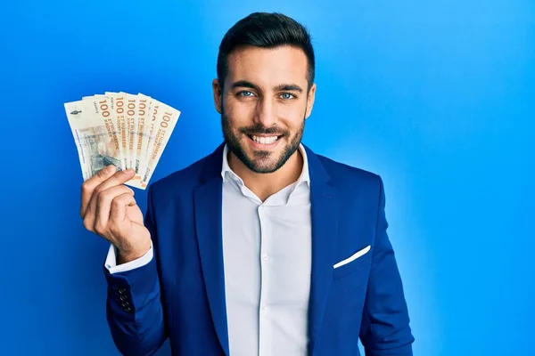 Joven Empresario Hispano Con Traje Negocios Sosteniendo Billetes Corona Denmark —  Fotos de Stock