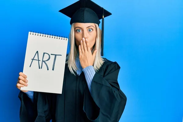 Beautiful Blonde Woman Wearing Graduation Cap Ceremony Robe Holding Art — Stock Photo, Image