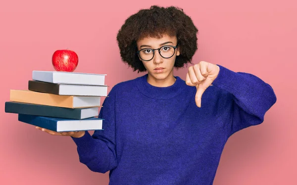 Young Hispanic Girl Wearing Glasses Holding Books Red Apple Angry — Stock Photo, Image