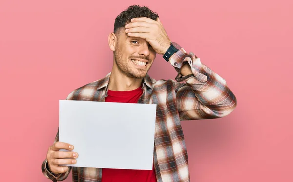 Young Hispanic Man Holding Blank Empty Banner Stressed Frustrated Hand — Stock Photo, Image