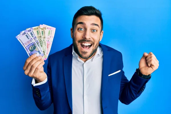 Young Hispanic Businessman Wearing Business Suit Holding Indian Rupee Banknotes — Stock Photo, Image