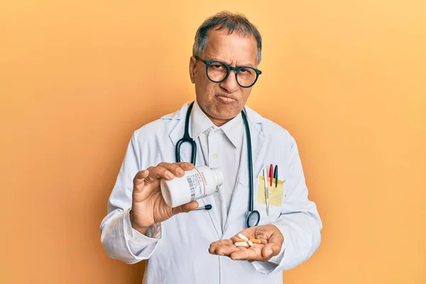 Middle Age Indian Man Wearing Doctor Uniform Holding Prescription Pills — Stock Photo, Image