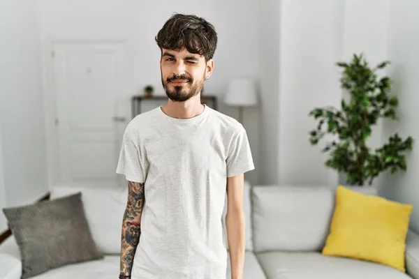 Hispanic Man Beard Living Room Home Winking Looking Camera Sexy — Stock Photo, Image