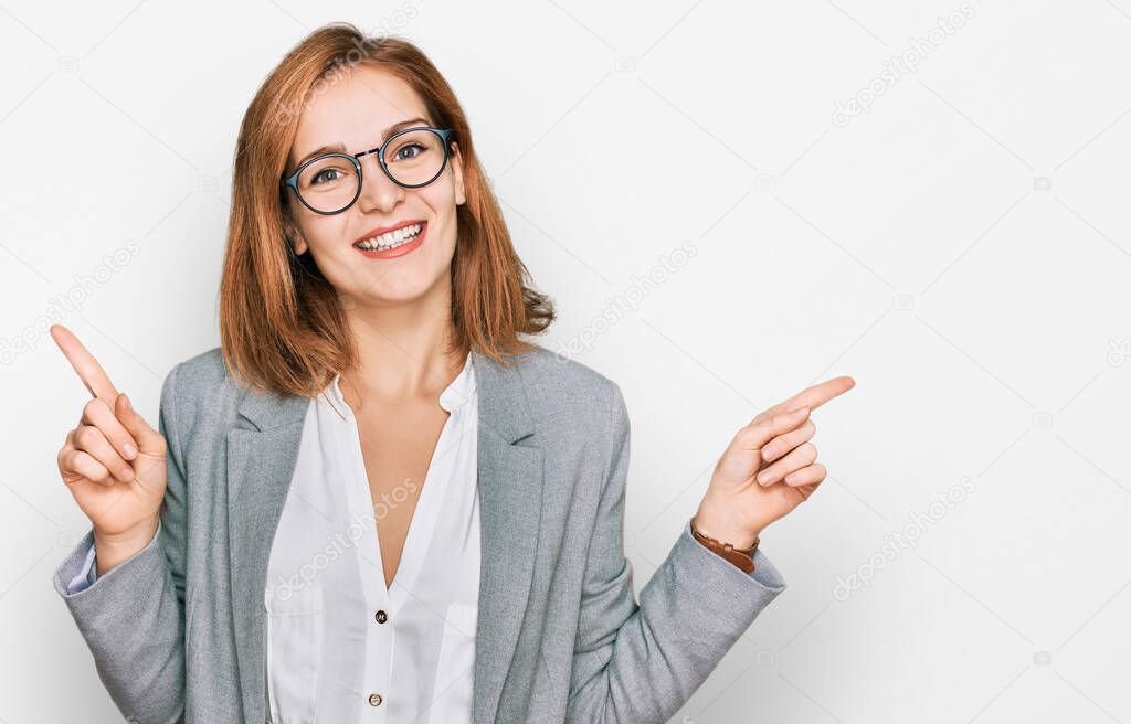 Young caucasian woman wearing business style and glasses smiling confident pointing with fingers to different directions. copy space for advertisement 
