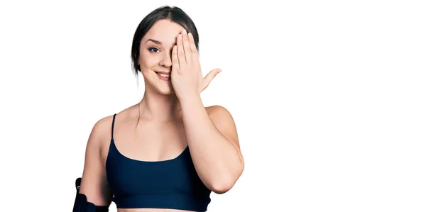 Young Hispanic Woman Wearing Sportswear Covering One Eye Hand Confident — Stock Photo, Image