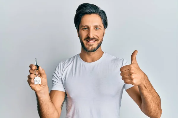 Young Hispanic Man Holding Keys New Home Smiling Happy Positive — Stock Photo, Image