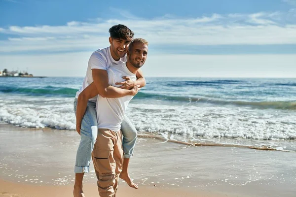 Lovely Gay Couple Piggyback Ride Beach — Stock Photo, Image