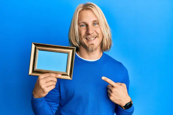 Caucasian Young Man Long Hair Holding Blank Empty Banner Smiling — Stock Photo, Image