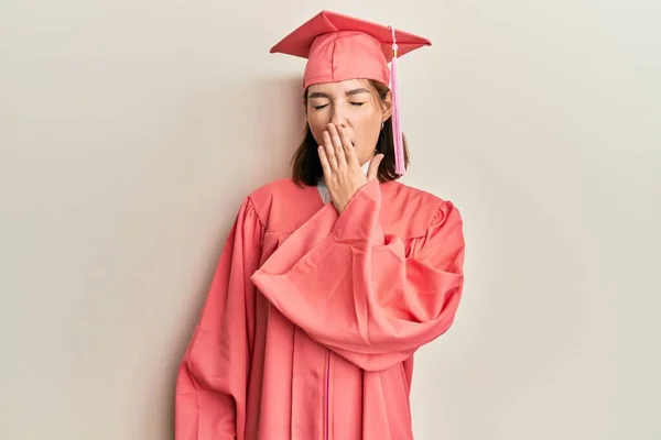 Young Caucasian Woman Wearing Graduation Cap Ceremony Robe Bored Yawning — Stock Photo, Image