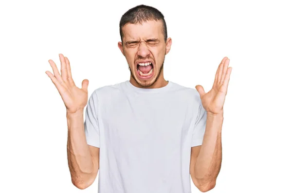 Hispanic Young Man Wearing Casual White Shirt Celebrating Mad Crazy — Stock Photo, Image