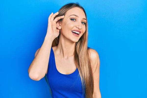 Young Blonde Girl Doing Listen Gesture Hand Ear Smiling Laughing — Stock Photo, Image