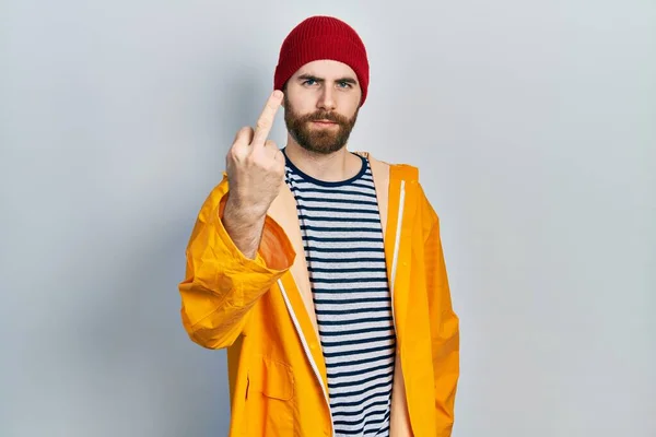 Caucasian Man Beard Wearing Yellow Raincoat Showing Middle Finger Impolite — Stok Foto