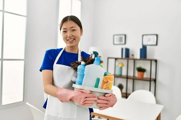 Young Chinese Housewife Holding Cleaning Products Standing Home — Stock Photo, Image