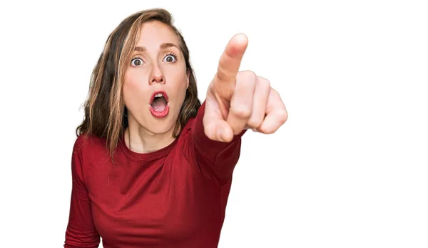 Young Blonde Woman Wearing Casual Clothes Pointing Finger Surprised Ahead — Stock Photo, Image