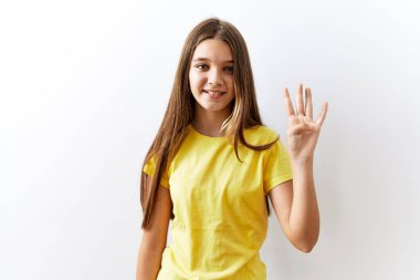 Young brunette teenager standing together over isolated background showing and pointing up with fingers number four while smiling confident and happy. 