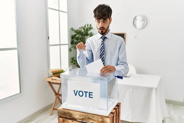 Hispanic Man Beard Voting Putting Envelop Ballot Box Pointing Fingers — Zdjęcie stockowe