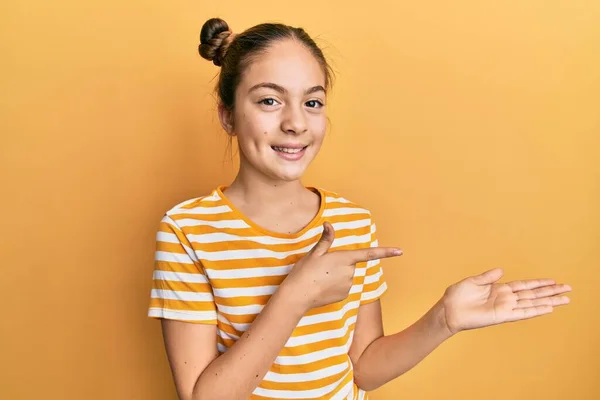 Beautiful Brunette Little Girl Wearing Casual Striped Shirt Amazed Smiling — Stock Photo, Image