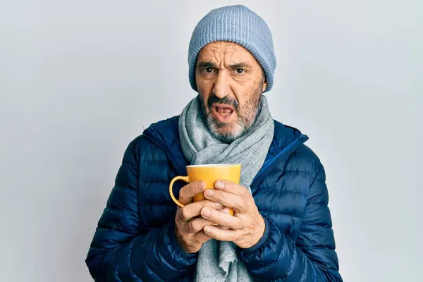 Middle Age Hispanic Man Wearing Winter Scarf Drinking Cup Hot — Zdjęcie stockowe