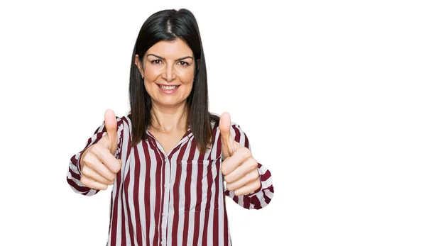 Beautiful Brunette Woman Wearing Striped Shirt Approving Doing Positive Gesture — Stockfoto
