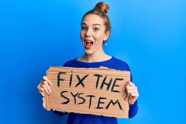 Young Blonde Woman Holding Fix System Banner Cardboard Celebrating Crazy — Stock Photo, Image