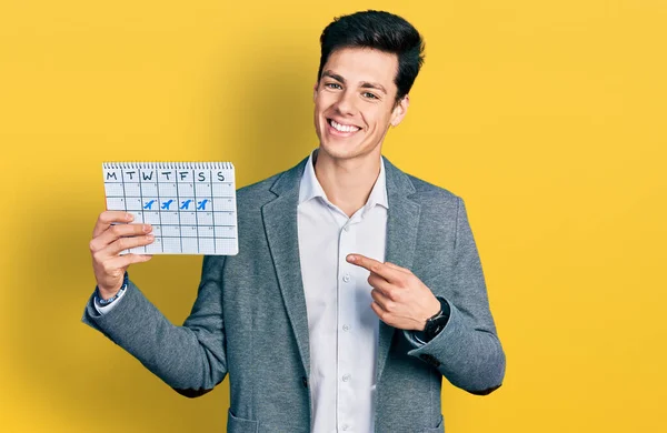 Young Hispanic Business Man Holding Travel Calendar Smiling Happy Pointing — Φωτογραφία Αρχείου