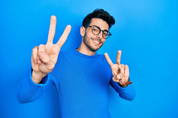 Young Hispanic Man Wearing Casual Clothes Glasses Smiling Looking Camera — Stock Photo, Image