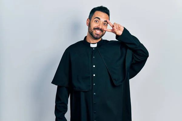 Handsome Hispanic Man Beard Wearing Catholic Priest Robe Doing Peace — Stock Fotó