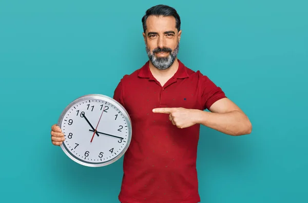 Middle Aged Man Beard Holding Big Clock Smiling Happy Pointing — Stockfoto