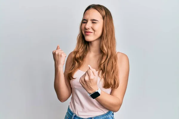 Young Blonde Woman Wearing Casual Style Sleeveless Shirt Celebrating Surprised — Stock Photo, Image