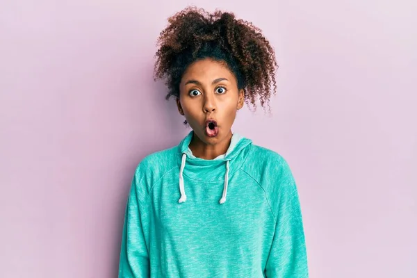 Beautiful African American Woman Afro Hair Wearing Casual Sweatshirt Scared — Zdjęcie stockowe