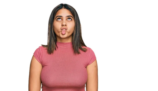 Young Hispanic Girl Wearing Casual Shirt Making Fish Face Lips — Stock Photo, Image