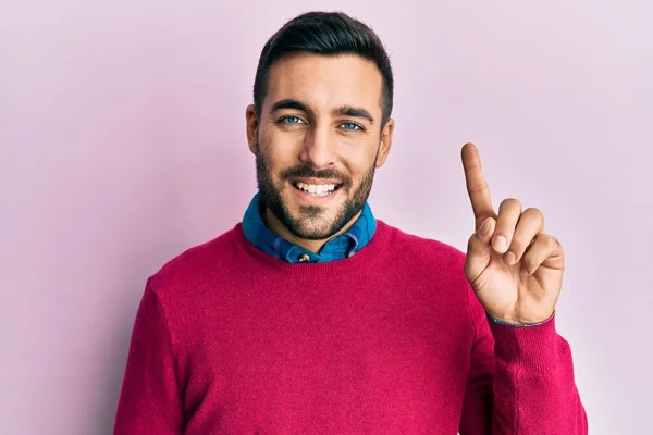 Young Hispanic Man Wearing Casual Clothes Showing Pointing Finger Number — Stock Photo, Image