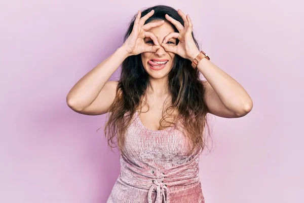 Young Hispanic Woman Wearing Casual Clothes Doing Gesture Binoculars Sticking — Stock Photo, Image