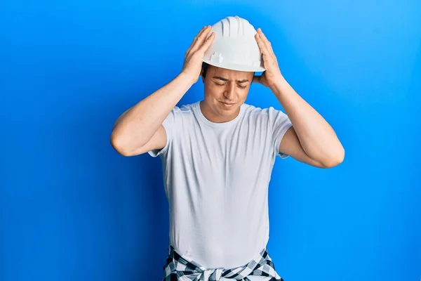 Handsome Young Man Wearing Builder Uniform Hardhat Suffering Headache Desperate — 스톡 사진