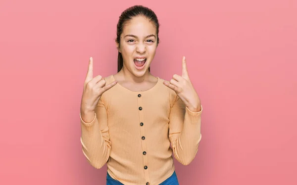 Beautiful Brunette Little Girl Wearing Casual Sweater Shouting Crazy Expression — Stock Photo, Image