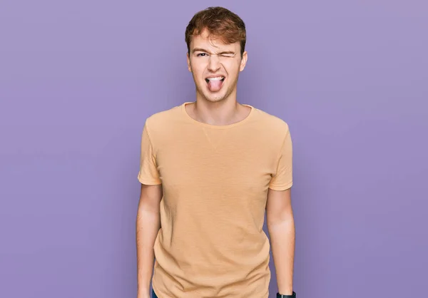 Young Caucasian Man Wearing Casual Clothes Sticking Tongue Out Happy — Stock Photo, Image