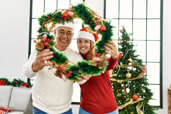 Middle Age Hispanic Couple Smiling Happy Holding Christmas Decor Home — Stock Photo, Image