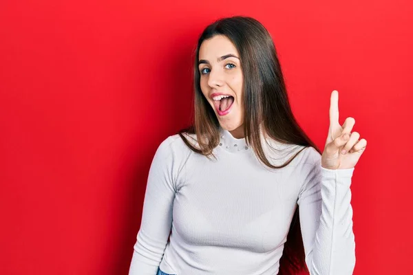 Young Brunette Teenager Wearing White Sweater Smiling Idea Question Pointing — ストック写真