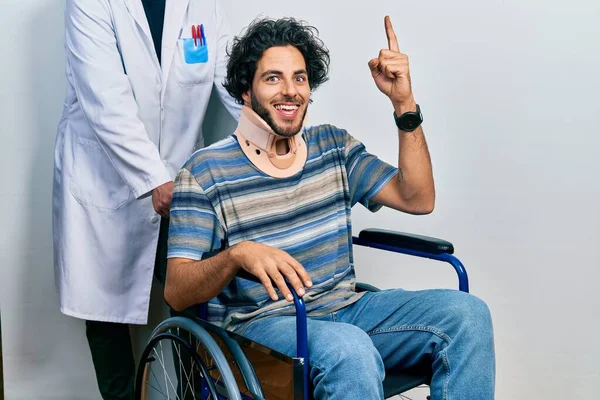 Handsome Hispanic Man Sitting Wheelchair Wearing Neck Collar Pointing Finger — Stock Photo, Image