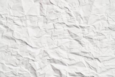 Kırışıklıkları olan beyaz buruşuk kağıt dokusu. Hasarlı ve yırtık çarşaf