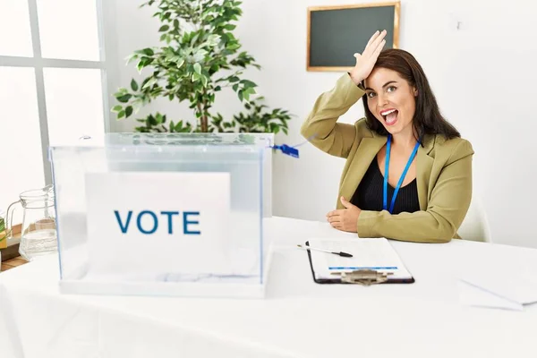 Young Brunette Woman Sitting Election Table Voting Ballot Surprised Hand — Stock Photo, Image