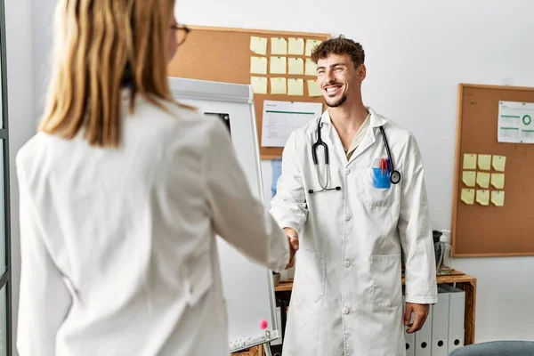 Two Hispanic Doctor Smiling Happy Celebrating Achievement Handshake Clinic Office — Stock Photo, Image