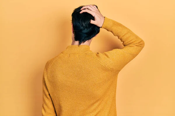 Handsome Hipster Young Man Wearing Casual Yellow Sweater Backwards Thinking — Stock Photo, Image