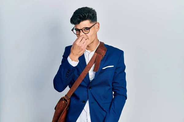 Young Hispanic Man Wearing Business Clothes Smelling Something Stinky Disgusting — Stock Photo, Image