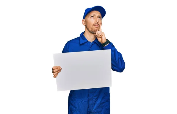 Bald Man Beard Wearing Builder Jumpsuit Uniform Holding Empty Banner — Stock Photo, Image