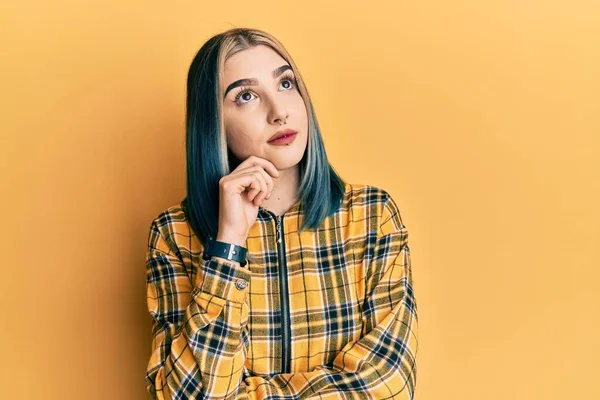 Young Modern Girl Wearing Casual Yellow Shirt Thinking Concentrated Doubt — Stock Photo, Image