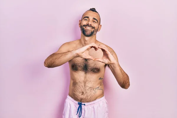 Young Hispanic Man Shirtless Wearing Swimsuit Smiling Love Doing Heart — Stock Photo, Image