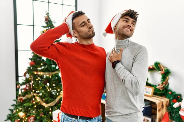 Young Gay Couple Standing Christmas Tree Wearing Hat Smiling Confident — ストック写真